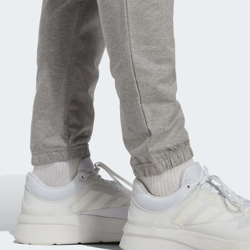 Men's adidas Essentials Single Jersey Tapered Badge of Sport Pants