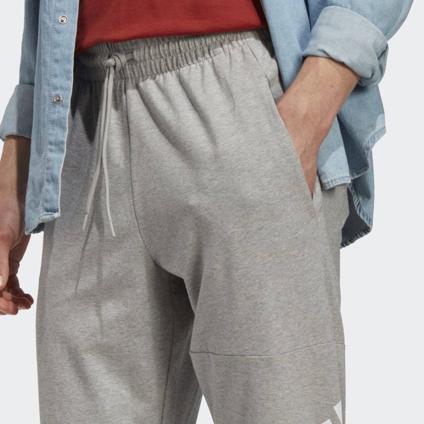 Men's adidas Essentials Single Jersey Tapered Badge of Sport Pants